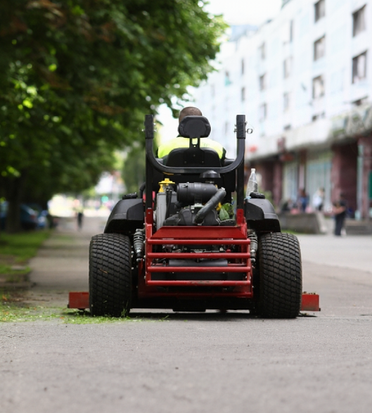 Lawn care professional mowing a lawn